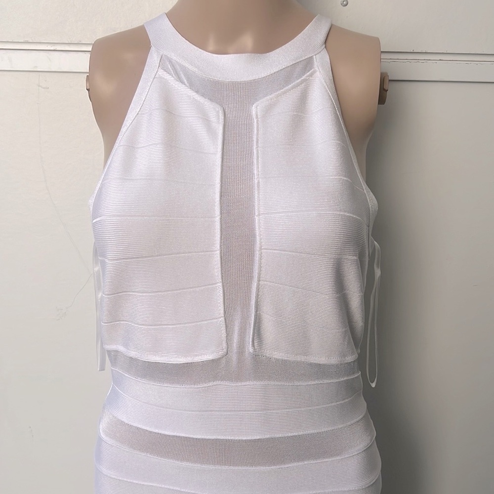 Guess body con white dress size Large On the tag, fit is medium.